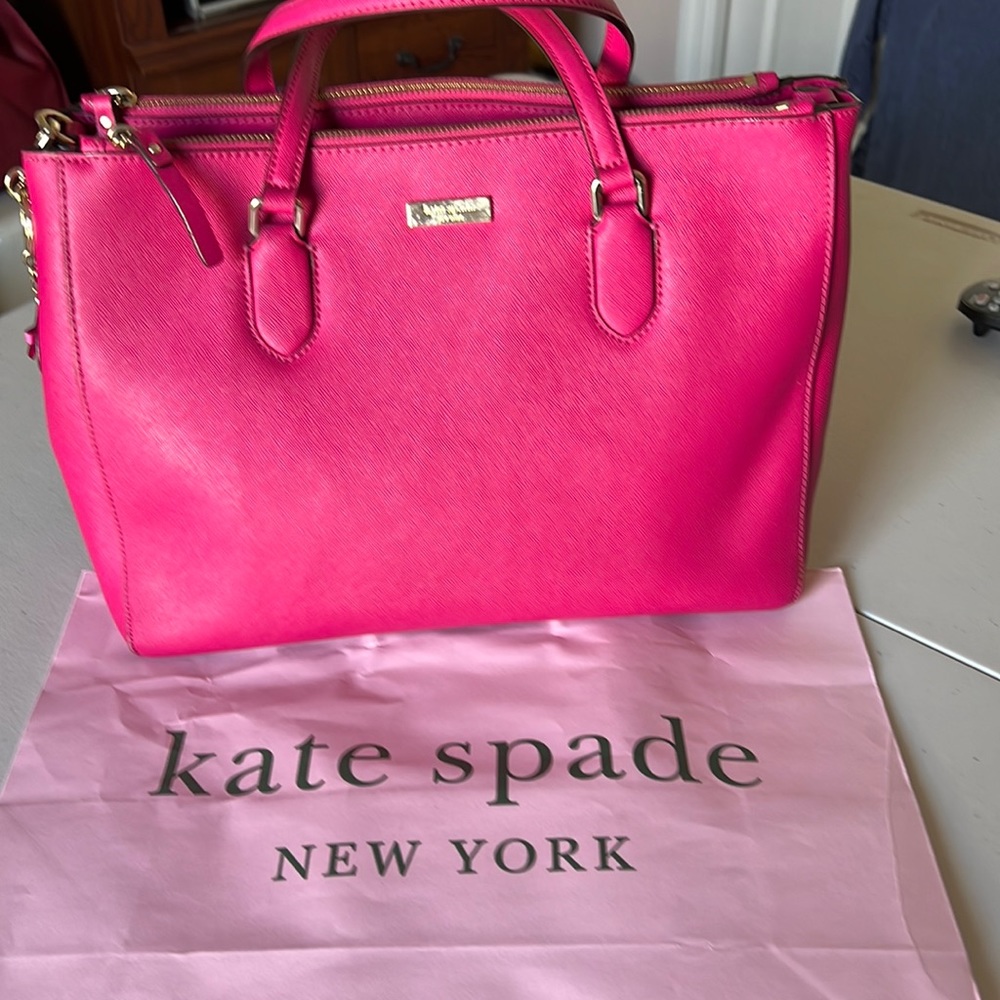 NWT Kate Spade handbag. Deep rose color.Height 10” and 14” wide. NWT